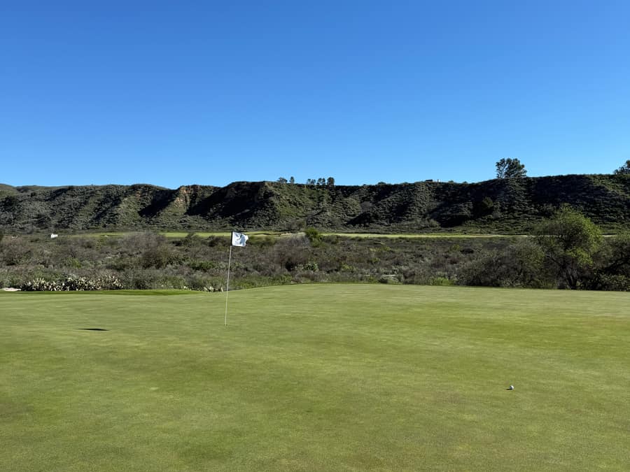 Green with ocean view in the distance