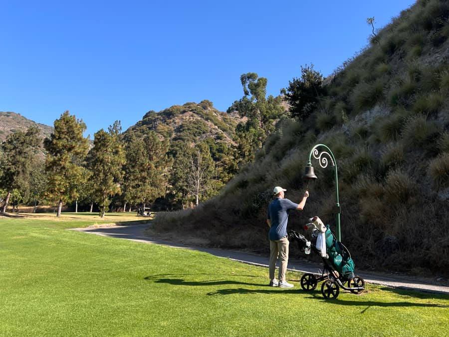 Push cart waiting on a lush fairway