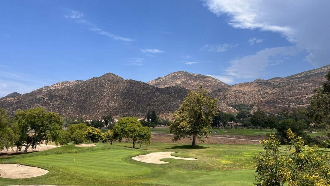 Golf course pond with fountain and fairway