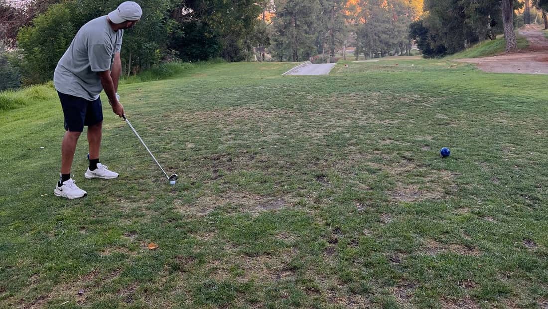 Morning light over a public golf course fairway